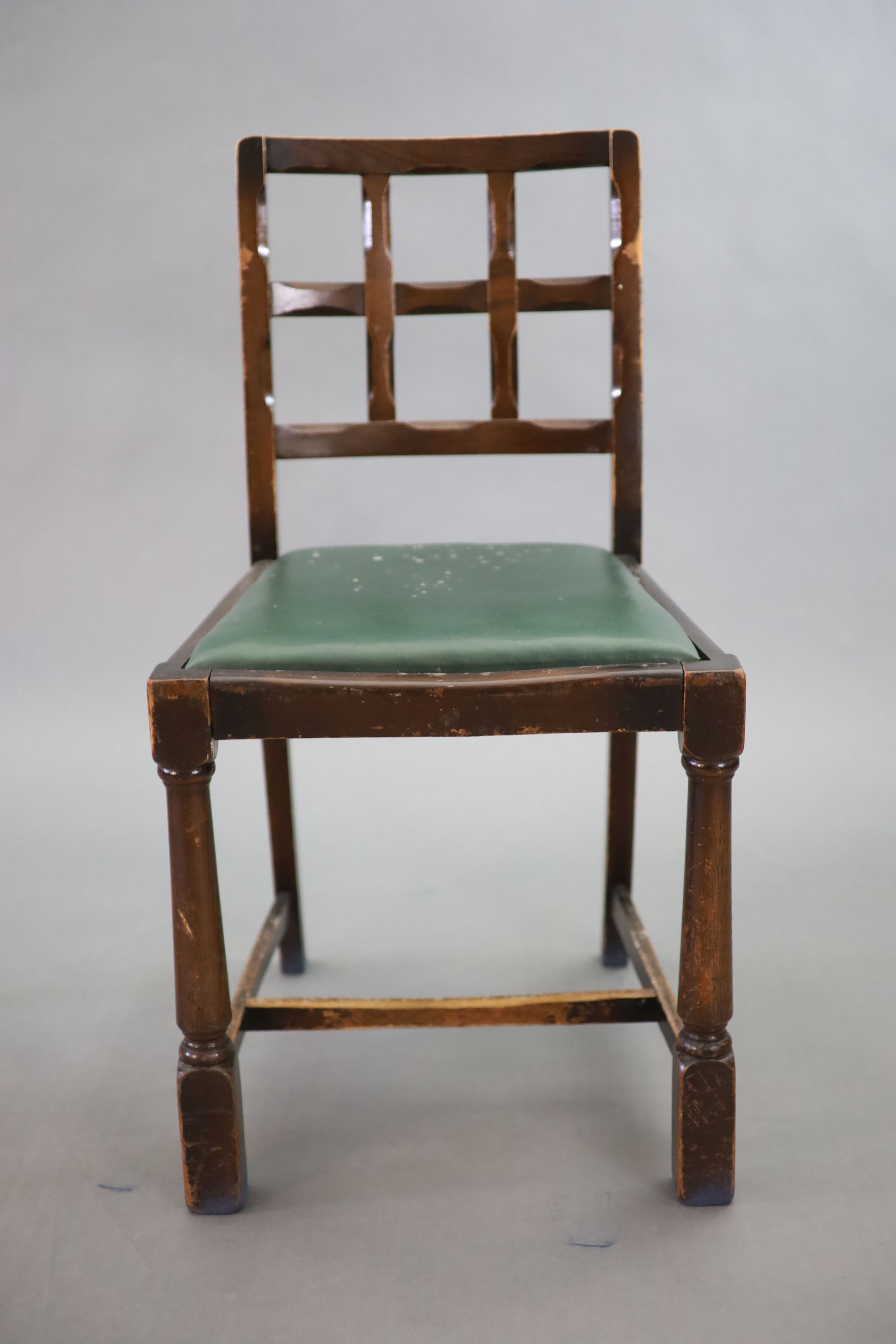 A set of eight early 20th century oak and beech dining chairs